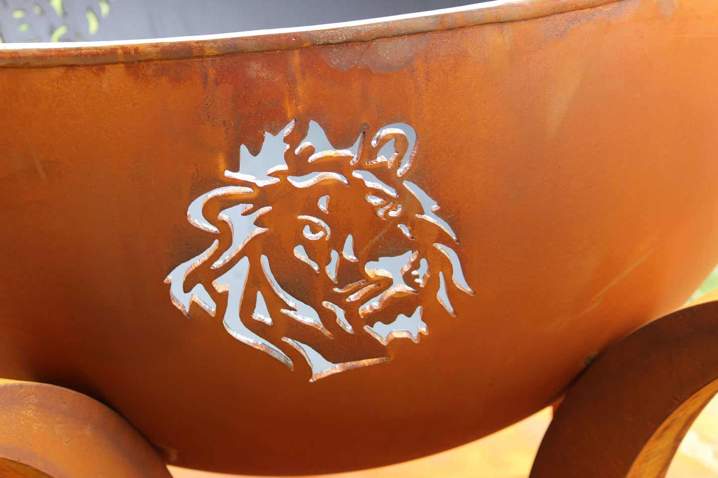 The Big Five Stainless Steel Fire Pit, displaying the beautiful Lion cut out.