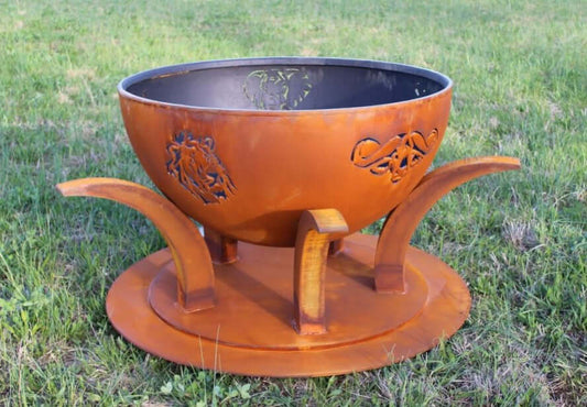 The Big Five Stainless Steel Fire Pit, Displayed on green grass.