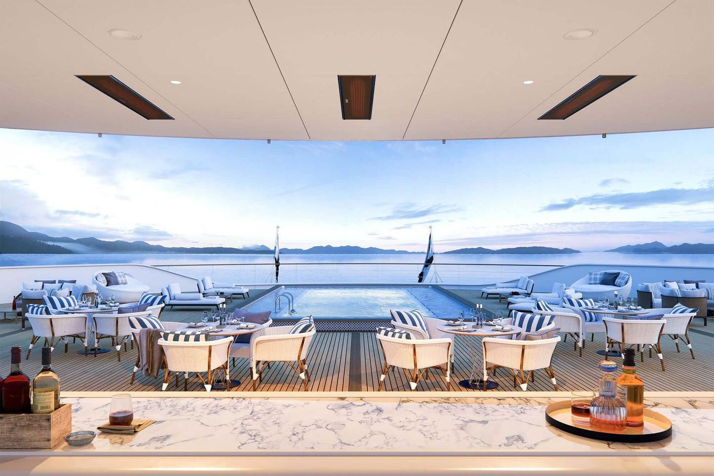Luxury yacht deck with pool, chairs, and views of the ocean, using the bromic marine heater