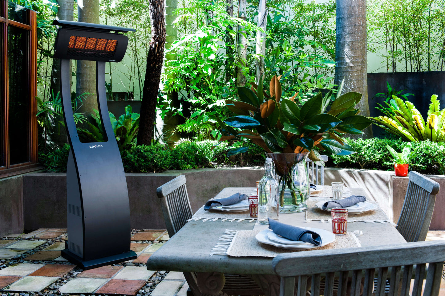 Outdoor dining setup with the Bromic Outdoor portable Patio Heater.