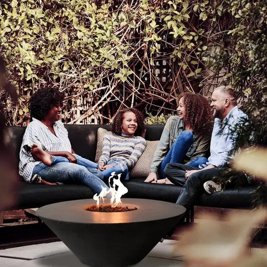 The Cairo Concrete Fire Bowl 01, being shown in a cozy setting, with family and friends gathered around the warm flame.