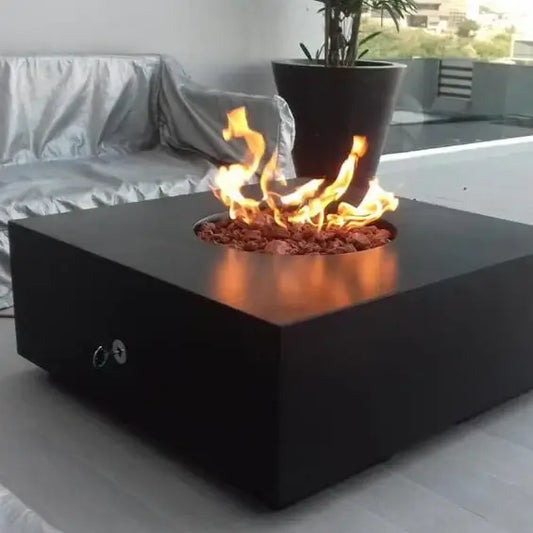 The elegant Praga Concrete Square Fire Pit, displayed in the Noir Color option on a Backyard patio