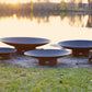 Asia Series oriental steel fire pit, showcasing all four available size variants in a comparative view.