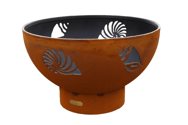 The Beachcomber Fire Pit with shell cut outs, on a white background
