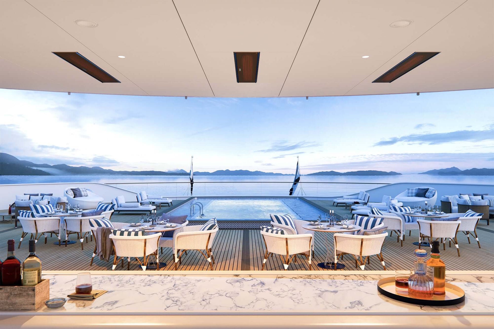 Luxury yacht deck with pool, chairs, and views of the ocean, using the bromic marine heater