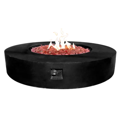 The Coliseo Concrete Cylinder Fire Pit 02 in the Noir color option. Displayed with a beautiful warm flame, on a white background.