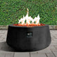The Indiana Modern Fire Pit 02. Showcased in the Noir color option with a warm flame, on a outdoor patio.