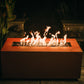 The hand crafted Linear Series Fire Pit, displayed on a cozy backyard patio with a warm flame.