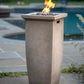 The 28 X 11 inch MGO Gas Outdoor Fire Pit, displayed on a poolside patio, with a warm flame.