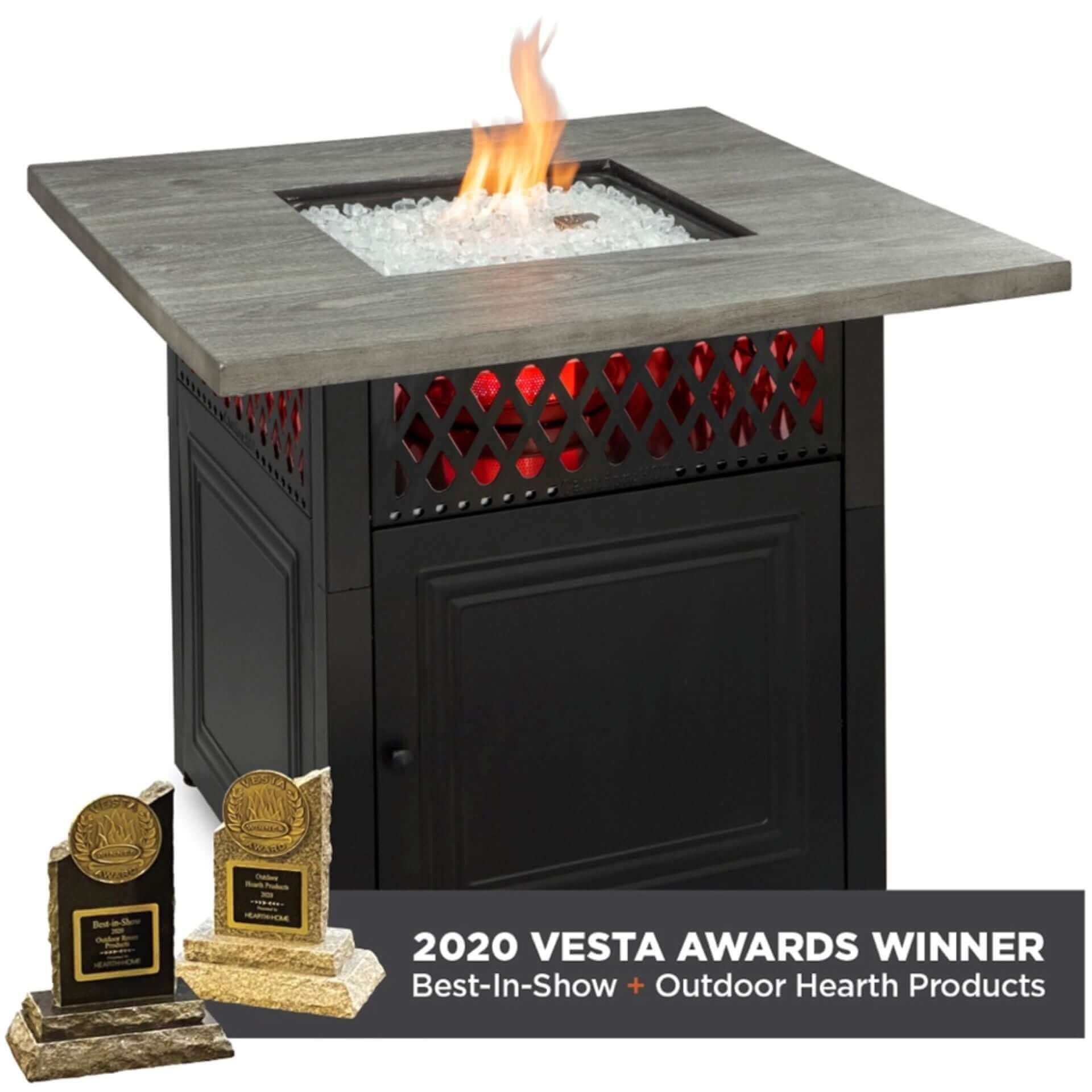 The award winning Dakota Dual Heat Gas outdoor firepit, displayed with a warm flame on a white background.