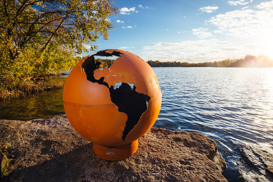 The Third Rock Fire Pit, Displayed on a lakeside rock.
